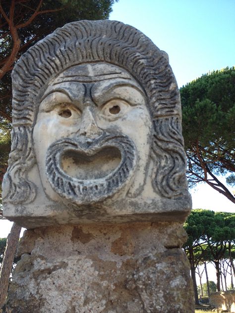 The Decumanus Maximus, the main street of Ostia Antica, paved with the original Roman stone