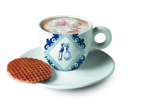 Traditional Dutch food in Amsterdam: a spread of typical local dishes including herring, cheese and stroopwafels