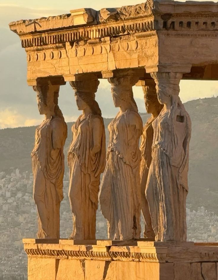 The Acropolis of Athens rising above the city at golden hour, with the Parthenon against the sky