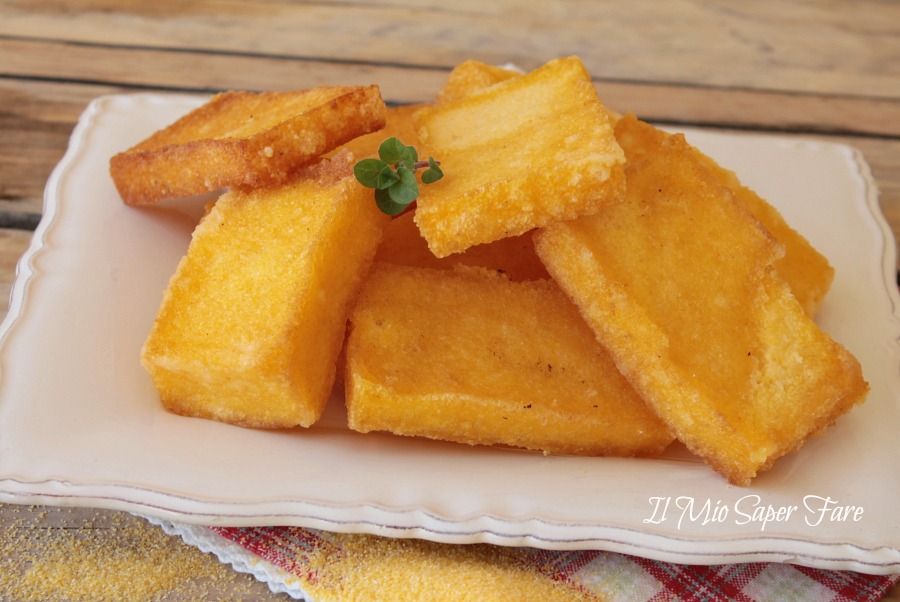Golden rectangles of fried polenta, sgagliozze, served hot in a paper cone