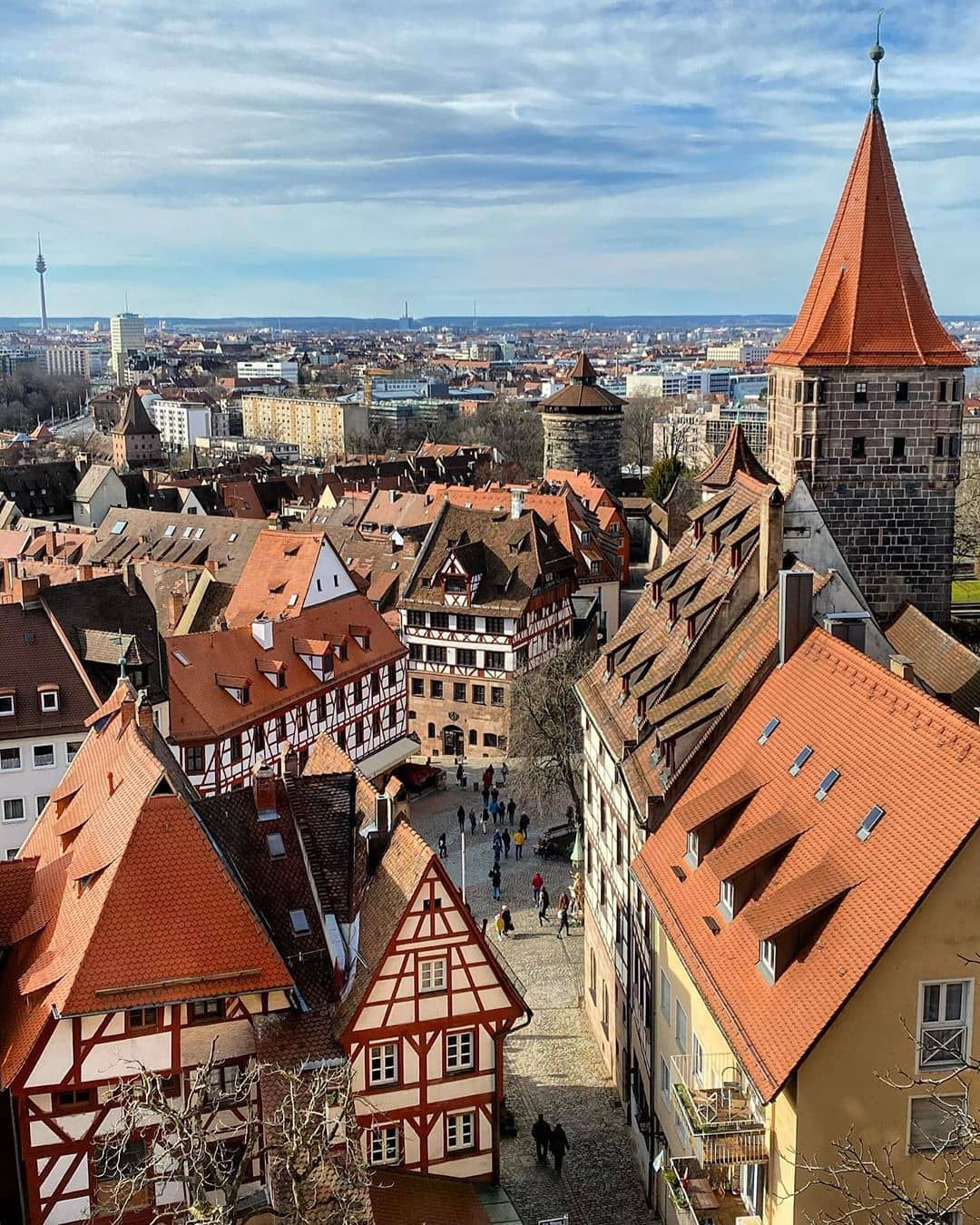 The beautifully preserved medieval old town of Nuremberg with its Imperial Castle and half-timbered houses reflected in the Pegnitz river