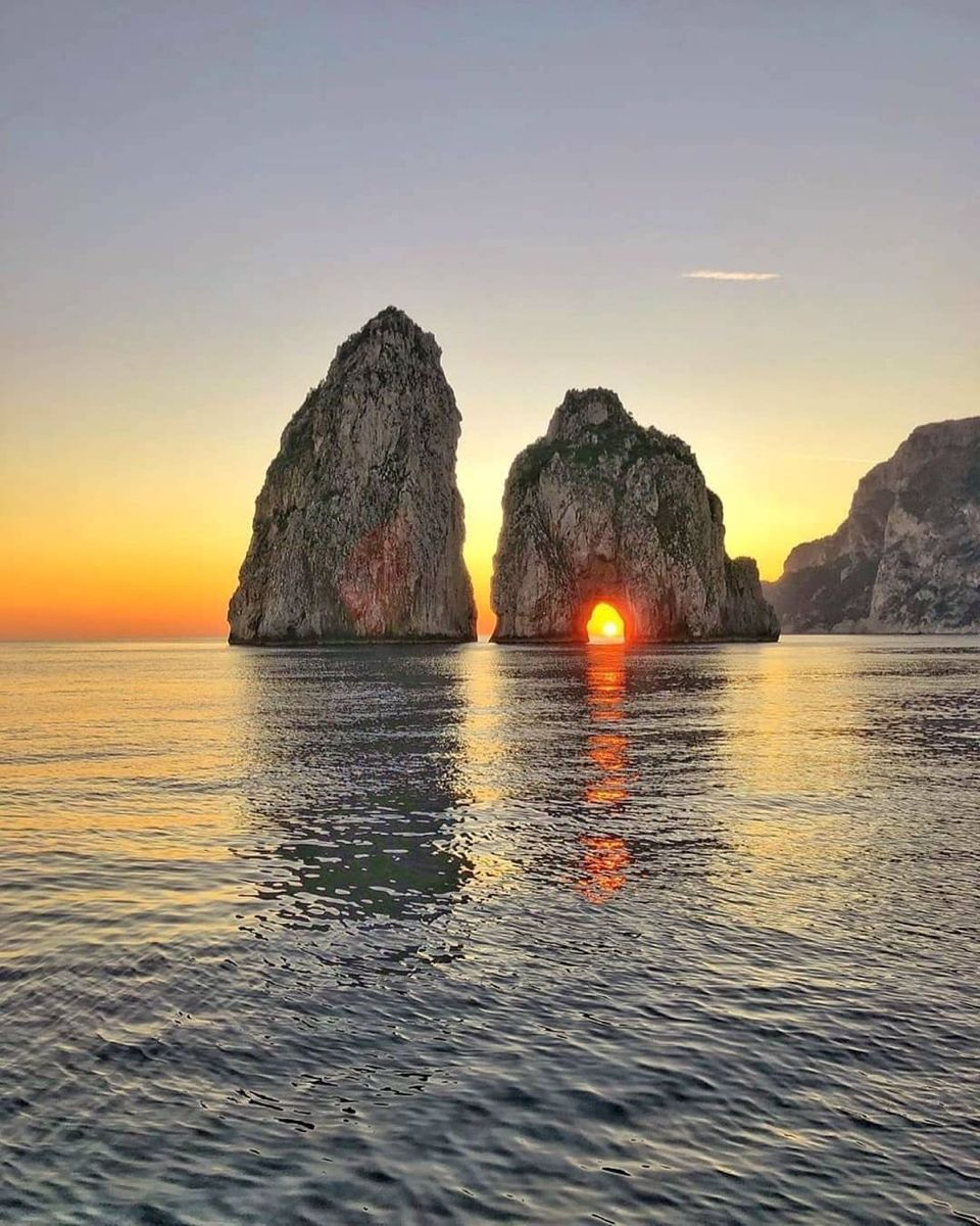 The Faraglioni sea stacks of Capri: the three limestone formations rising from the sea on the island\'s southern coast