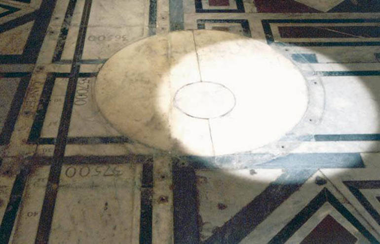 The bronze gnomon hole (bronzina) at the base of Brunelleschi's dome in Florence Cathedral, 90 metres above the floor