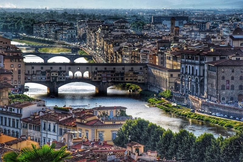 Florence from above: the Duomo, the Palazzo Vecchio tower and the Renaissance city skyline across the Arno valley