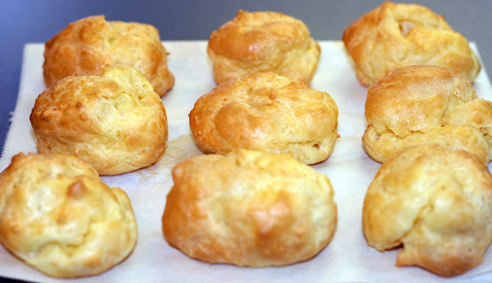 The Route des Grands Crus winding through the gold and russet vineyards of the Cote de Nuits in Burgundy in autumn