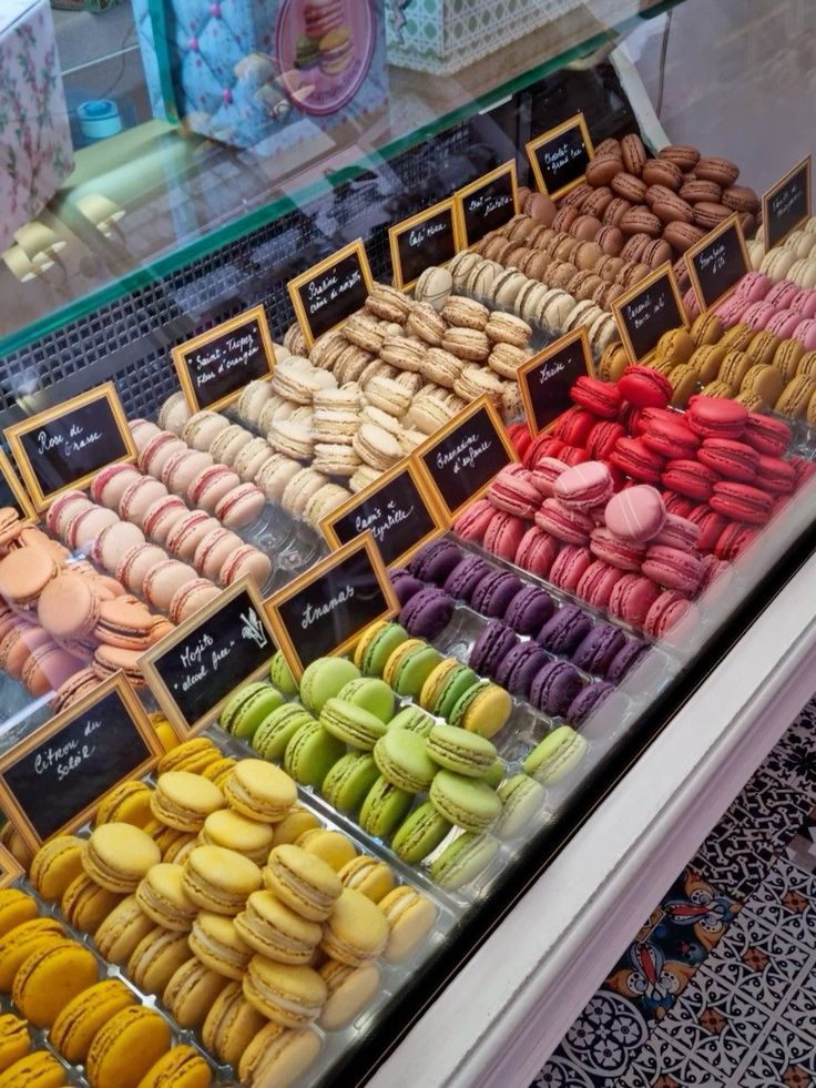 A magnificent display of French pastries and patisserie in a Parisian shop window on Rue Montorgueil
