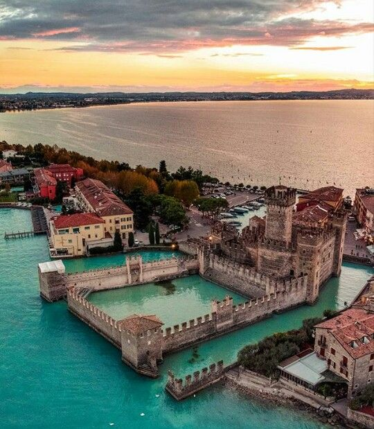 The magnificent Rocca Scaligera castle guarding the entrance to the medieval walled town of Sirmione on its narrow peninsula extending into southern Lake Garda