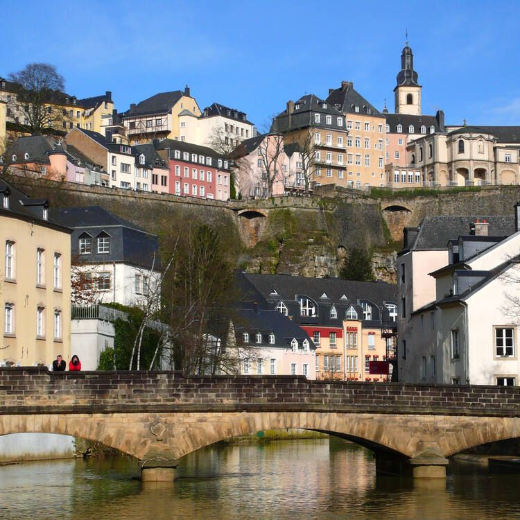 The dramatic panorama of Luxembourg City, with the ancient ramparts, the deep Alzette gorge and the Grund district below, seen from the Chemin de la Corniche