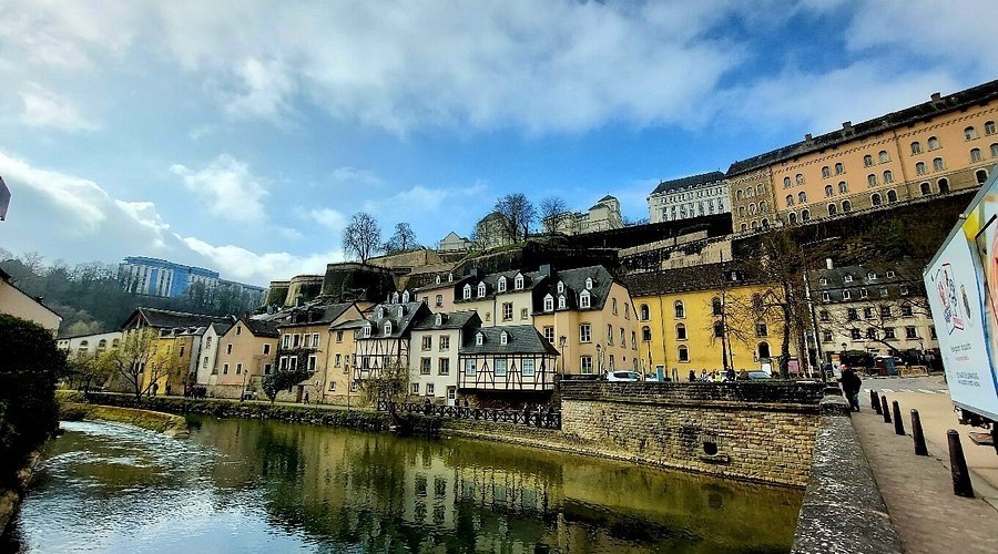 The picturesque Grund district of Luxembourg City, nestled in the deep gorge of the Alzette river beneath the ancient ramparts and fortifications of the Old Town