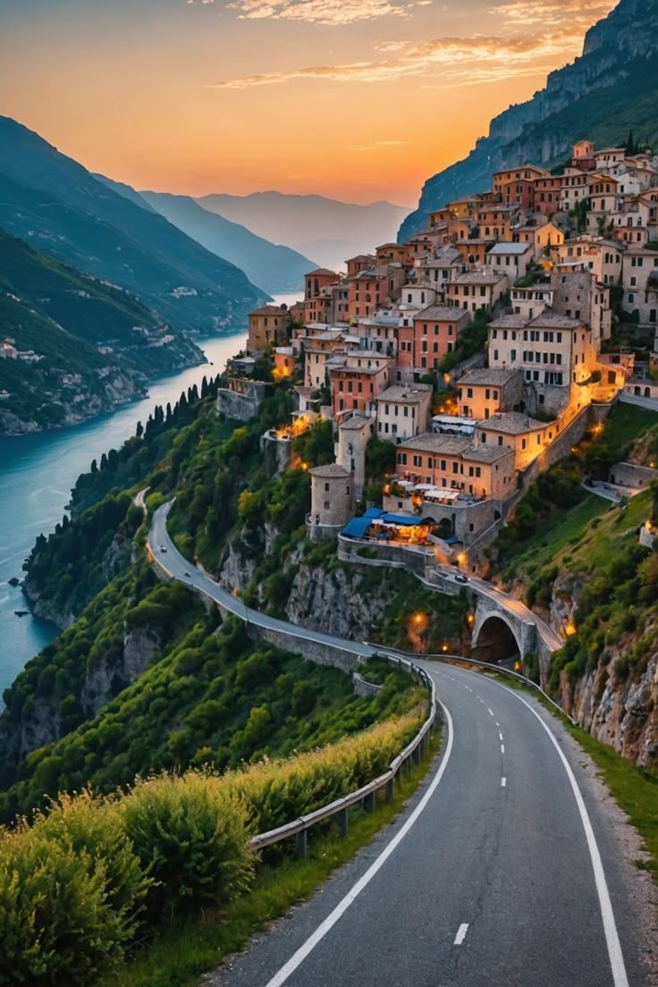 Lake Garda in October, with golden autumn colours reflecting on the calm water and mountains in the background