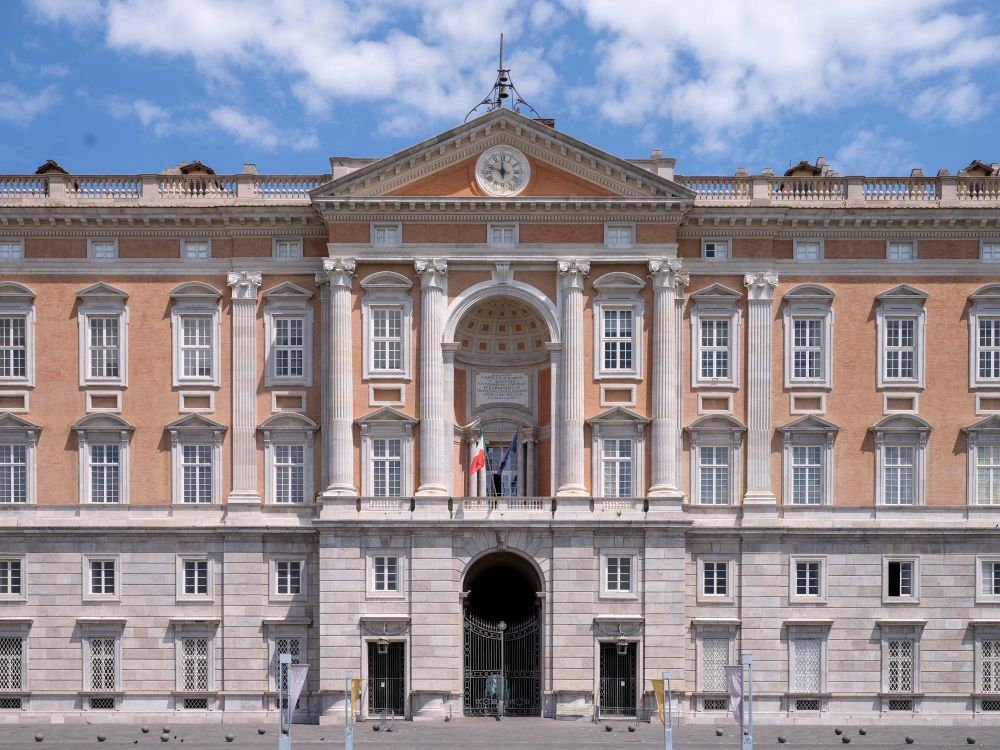 The immense facade of the Royal Palace of Caserta, stretching nearly 250 metres across the Piazza Carlo di Borbone.