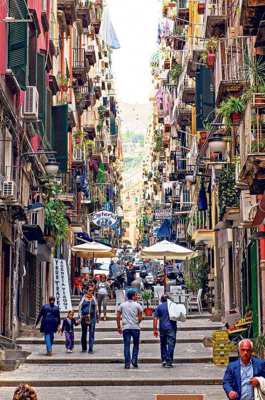 The Spaccanapoli, the narrow ancient street that runs from east to west through Naples' historic centre, lined with churches, shops and laundry hung from balconies.