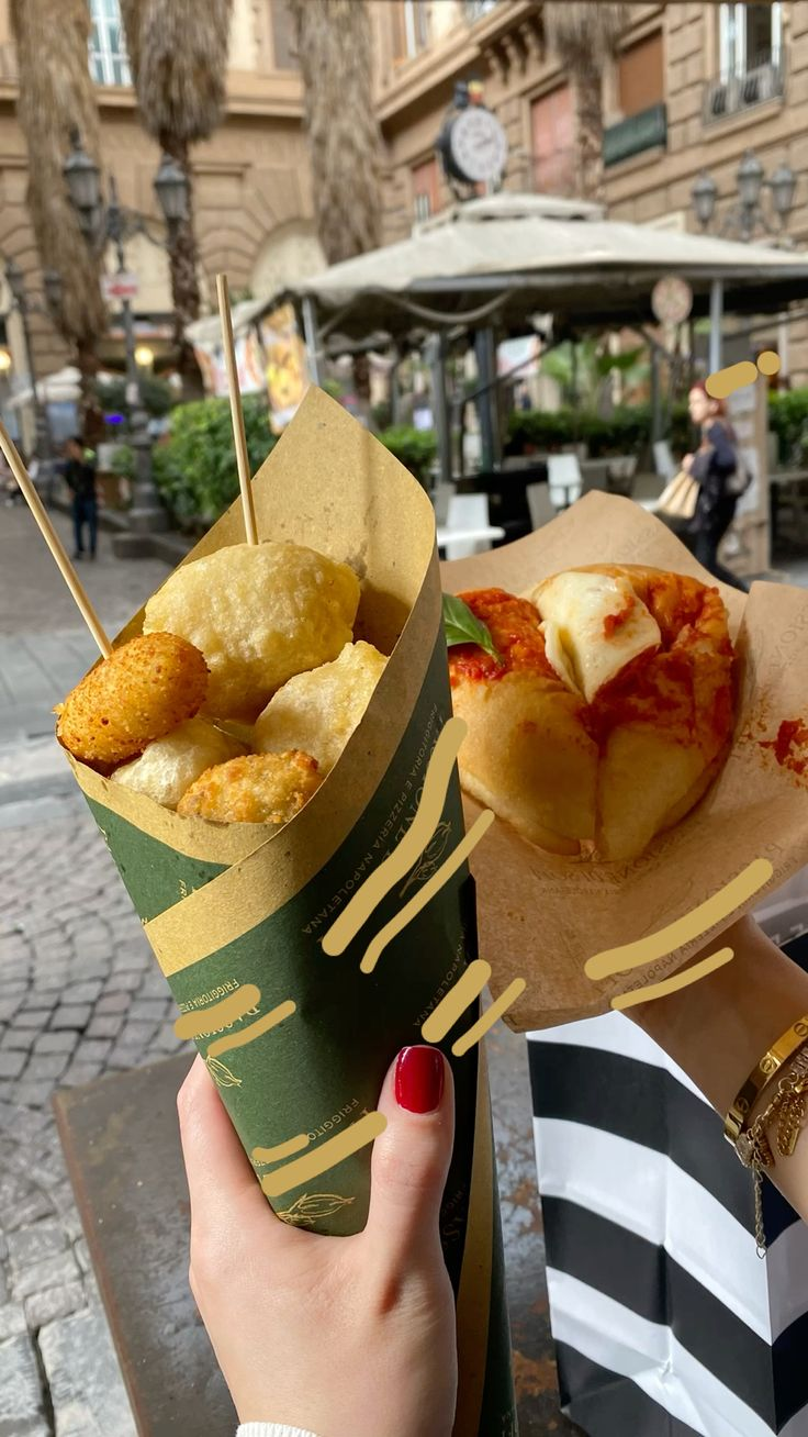 A paper cone of cuoppo, the quintessential Neapolitan street food, filled with golden fried seafood and vegetables, held over the ancient stones of Spaccanapoli.