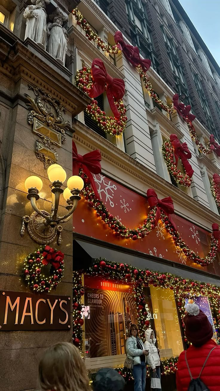Macy's department store on Herald Square in Manhattan at Christmas, with its legendary window displays and the festive illumination of the world's largest department store by floor space
