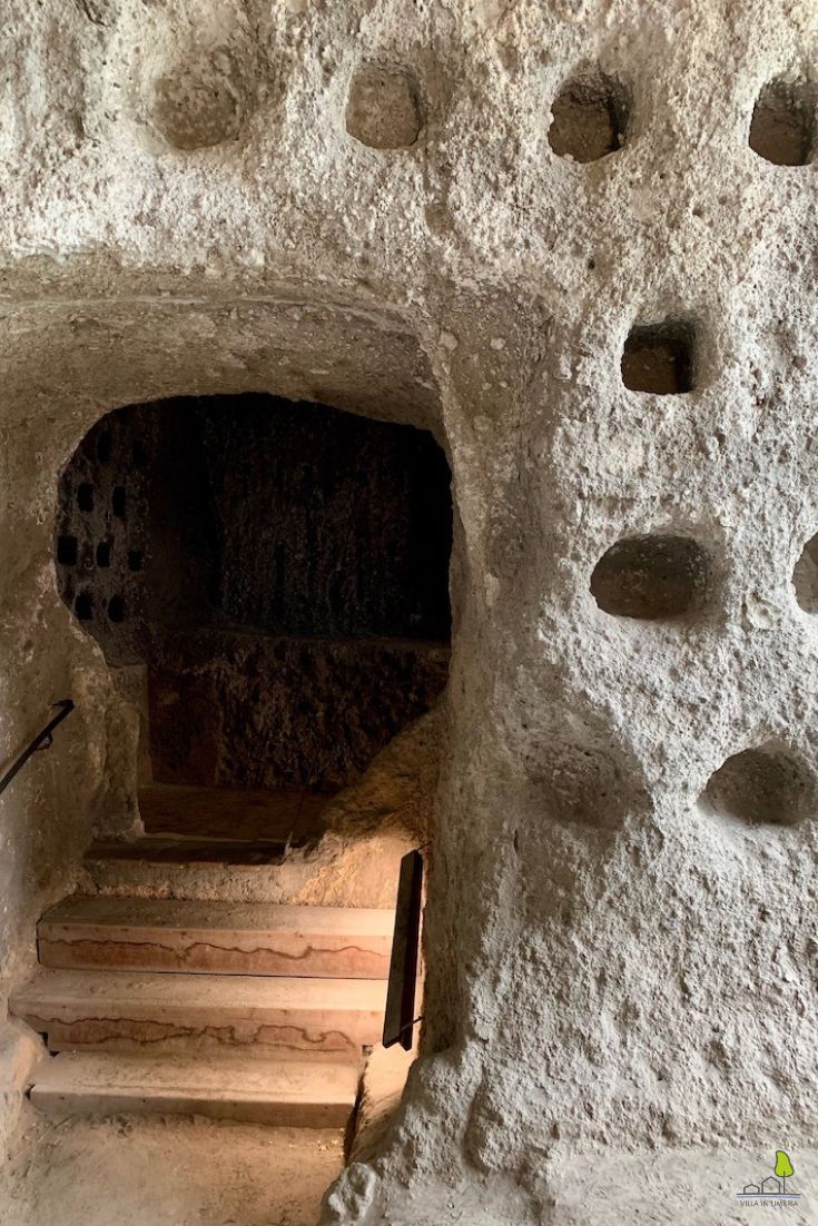 The underground pyramid shaft of Orvieto, carved into the tufa rock, with the spiral staircase descending into the darkness
