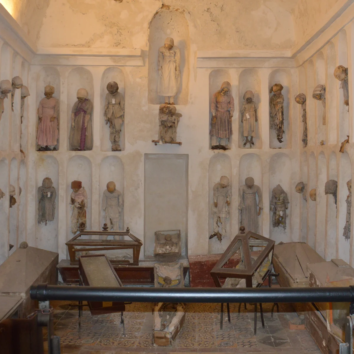 The children's corridor of the Capuchin Catacombs, where infants and toddlers rest in small glass coffins