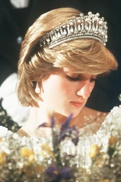 The Flame of Liberty memorial at the Pont de l'Alma in Paris, covered with flowers, photographs and handwritten messages left by mourners for Princess Diana.