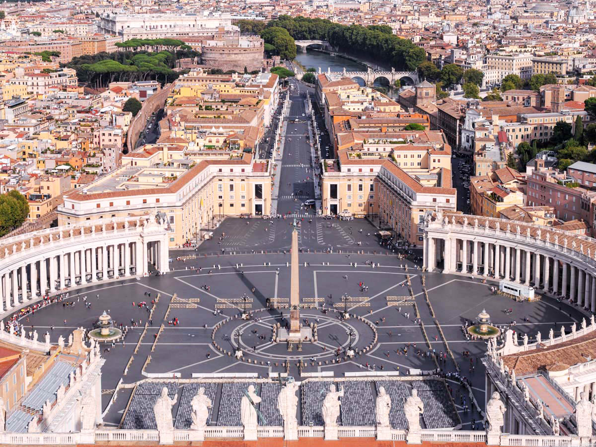 The roof terrace of Saint Peter's Basilica with the great statues of the saints and the drum of Michelangelo's dome rising above
