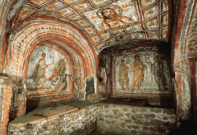 The galleries of the Catacombs of San Callisto on the Via Appia in Rome, with loculi cut into the tuff walls on both sides
