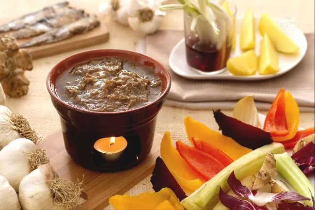 A traditional Piedmontese bagna cauda served hot with an assortment of raw and boiled vegetables for dipping