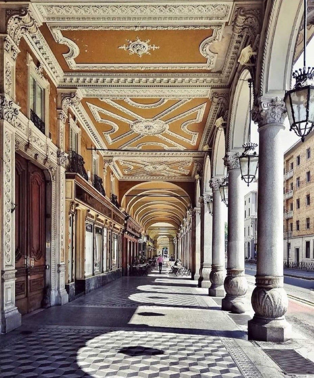 The arcaded baroque streets of Turin's historic centre, where Palazzo Feyles stands on the corner of Corso Vittorio Emanuele II