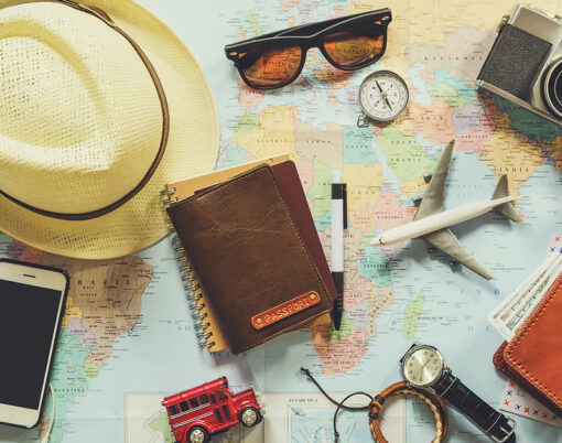A traveller at the airport preparing to board a flight, luggage ready and documents in hand
