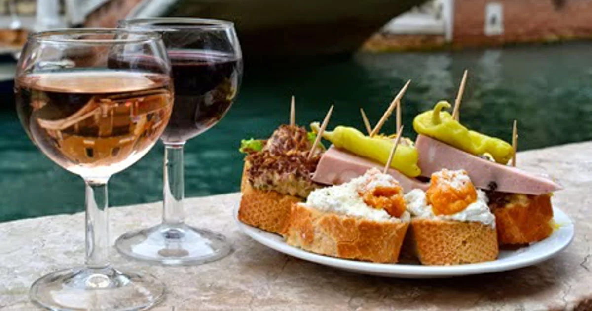 A classic Venetian Spritz al Aperol at a canal-side bacaro, the quintessential aperitivo of Venice