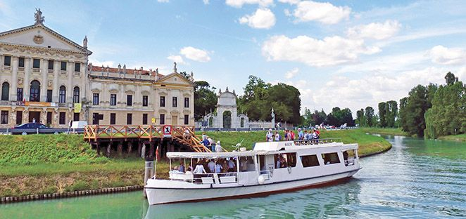 A boat cruise along the Brenta Riviera with Palladian villas reflected in the river