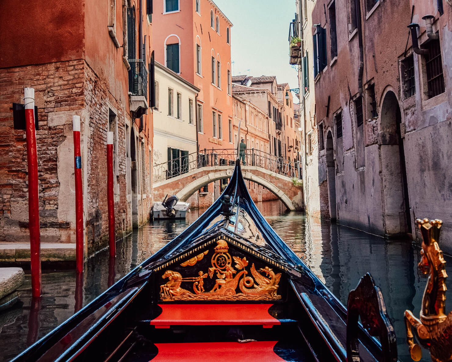 Traditional gondolas moored on the Grand Canal in Venice with the Salute church in the background
