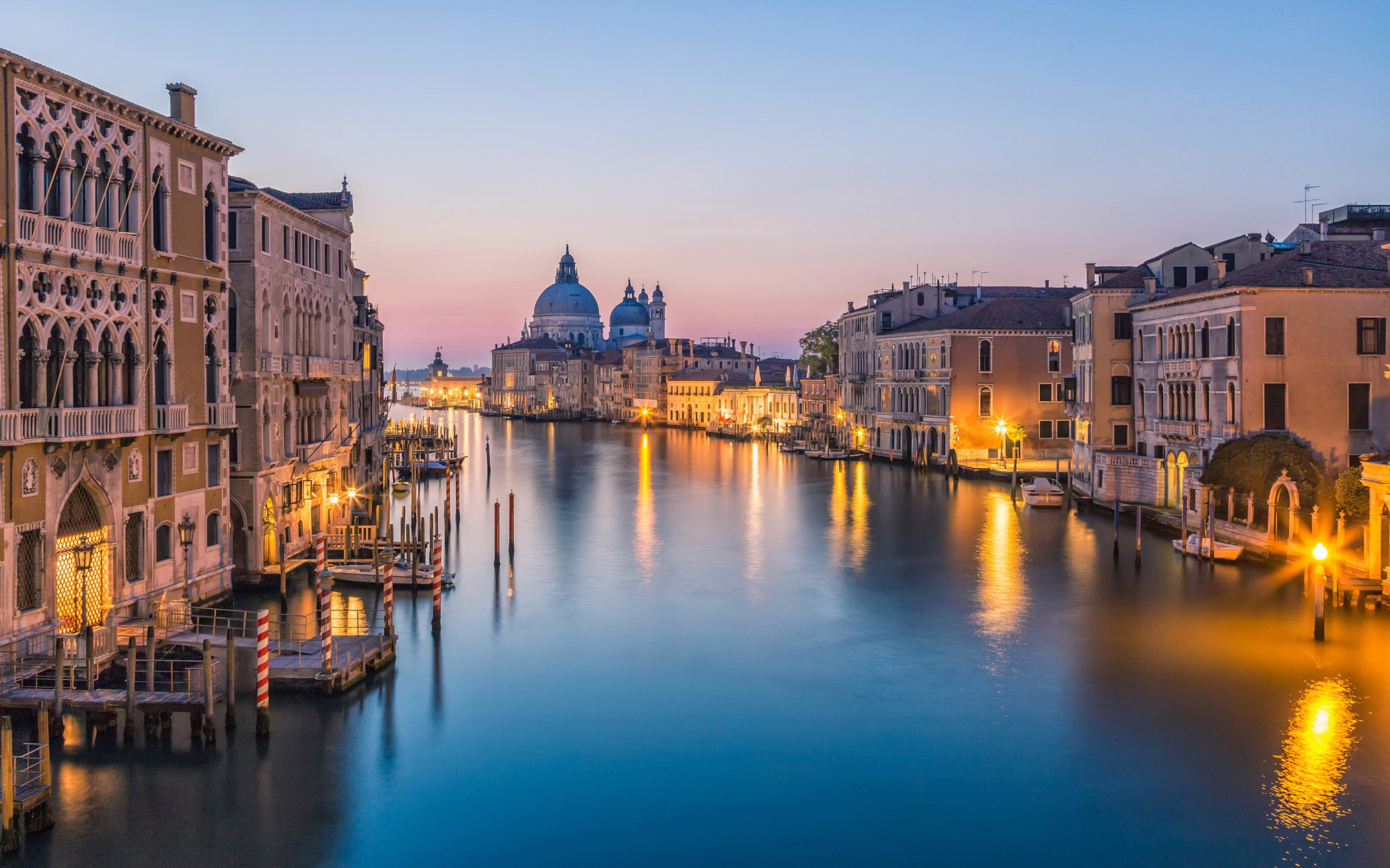 The Grand Canal in Venice at night, the palaces and their reflections in the still dark water
