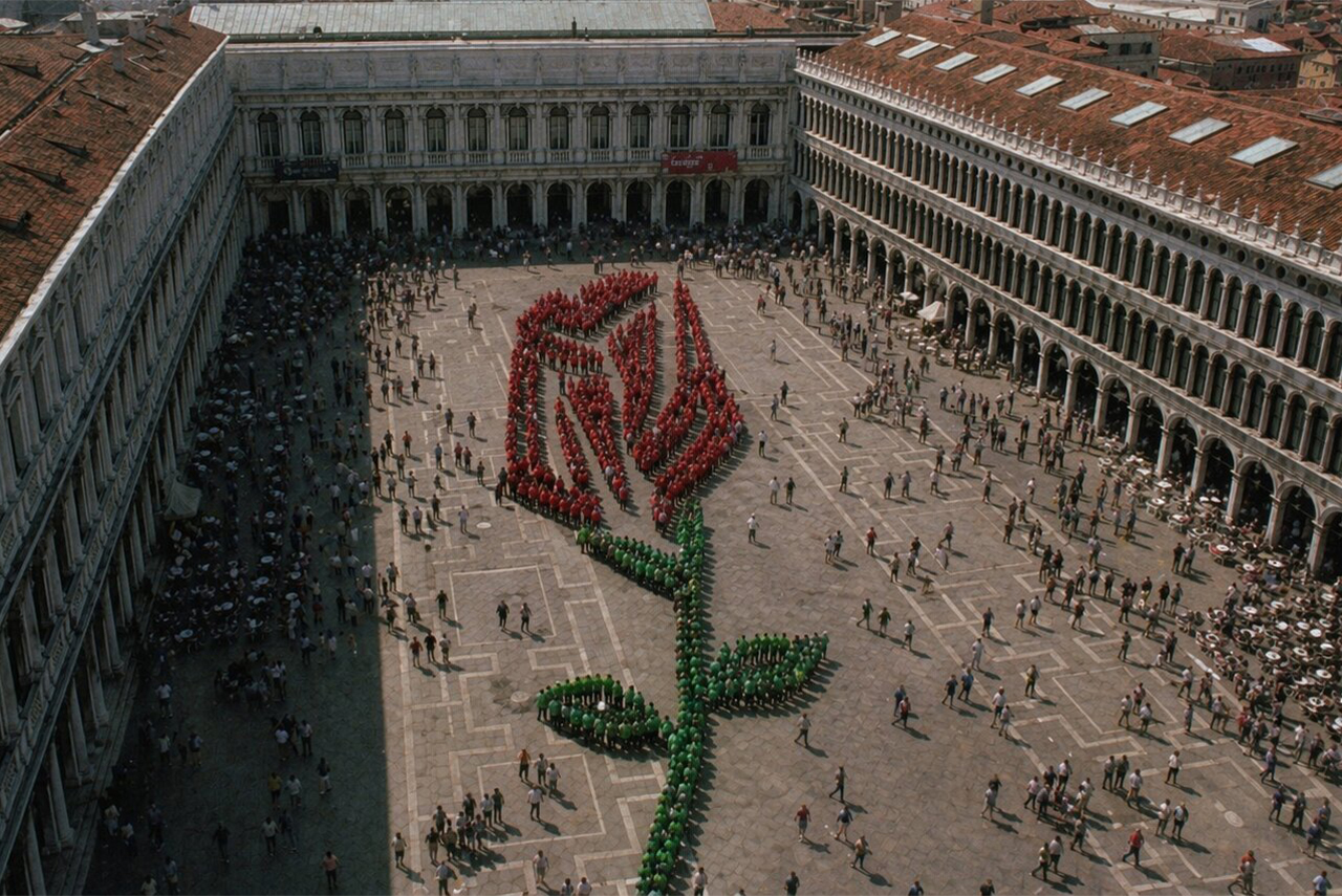 A single red rose bud, the bocolo, the symbol of Venice's most intimate and most ancient romantic tradition