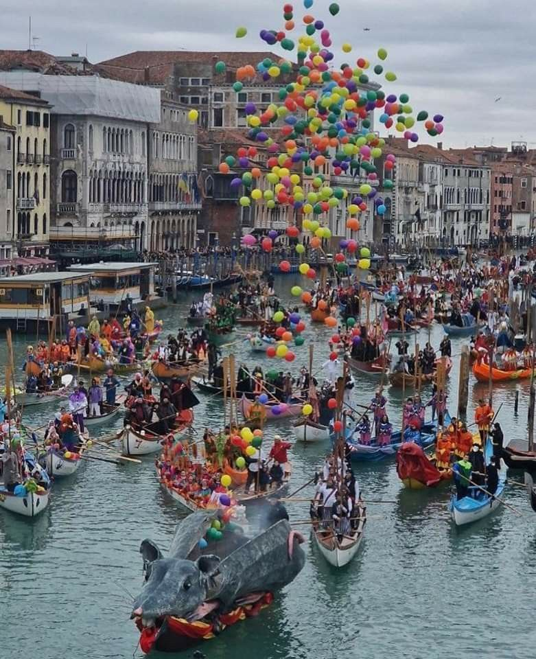 Venetian carnival masks floating through the mist of the Grand Canal at dawn