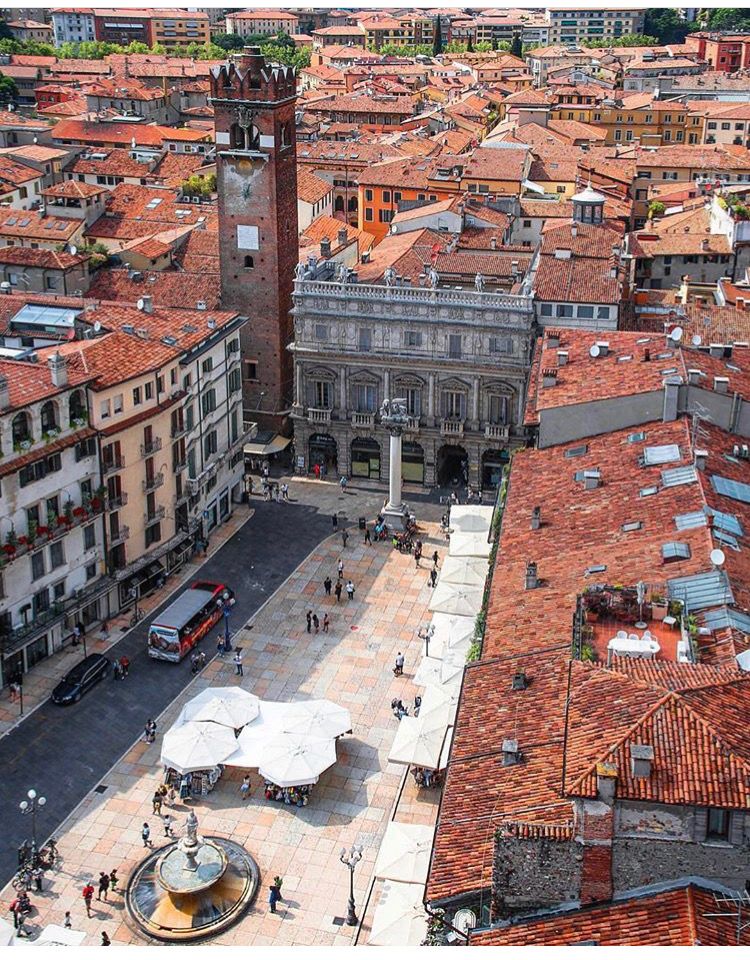 The historic centre of Verona with the Adige river and the Roman arena in the background