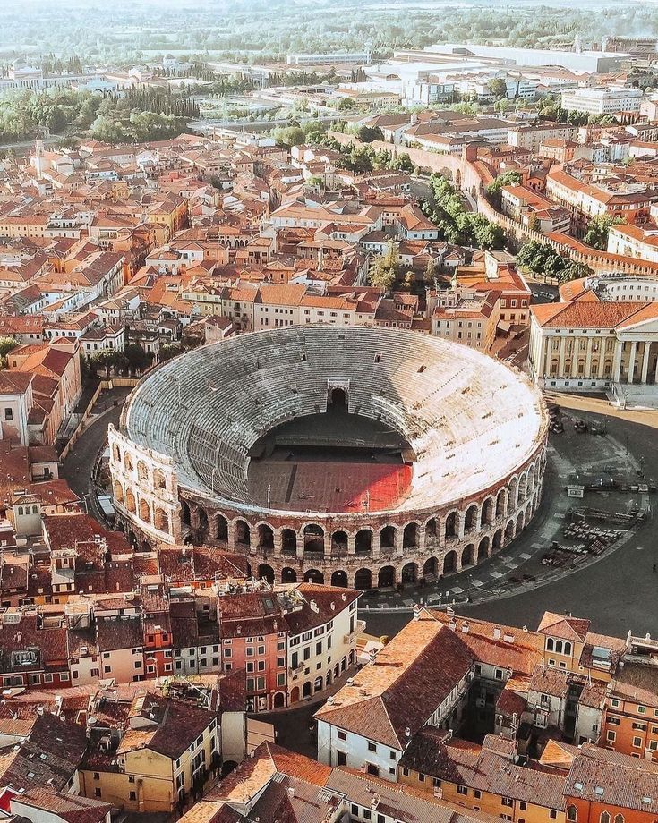 Verona, the city of Romeo and Juliet, with its Roman arena and medieval towers rising above the Adige river