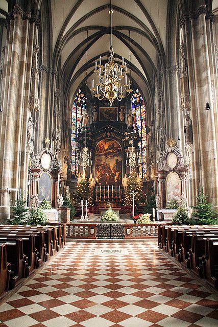 The Stephansdom in Vienna, its decorated tiled roof and Gothic south tower rising above the rooftops of the first district